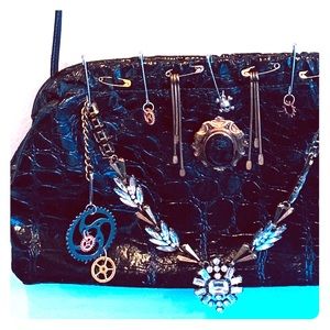 Steampunk purse with vintage pins and accessories